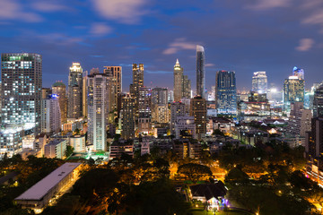 Fototapeta na wymiar Bangkok cityscape at dusk. Landscape of Bangkok business building around downtown. Modern high building in business district area at night in Thailand..