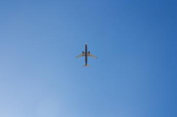 An airplane crosses the sky