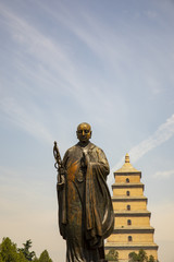 Statue of Xuanzang standing  in front of Big WIld Goose Pagoda, Xian, China