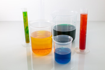 Laboratory glassware with colorful chemical reagent in research laboratory