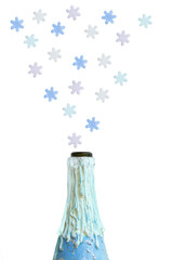 Decorated bottle of champagne and snowflakes. White isolate.