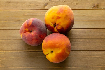 Fototapeta na wymiar Juicy organic peaches on the kitchen table waiting to be eaten