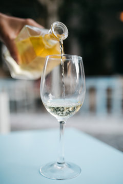 White home wine poured into a glass