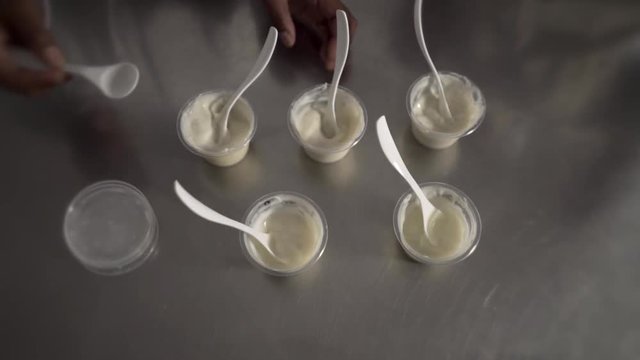 Food technologists sample different recipes of food in laboratory time lapse.