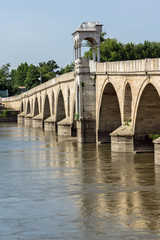 Obraz premium Medieval Bridge from period of Ottoman Empire over Meric River in city of Edirne, East Thrace, Turkey