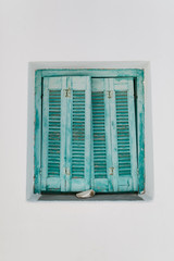 Blue shutters of traditional island Greek home, Paros island