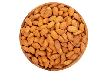 Almonds in wooden dish on white background.