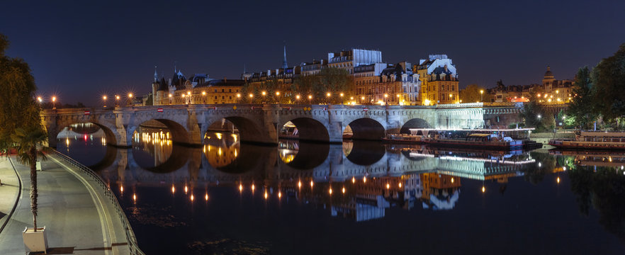 Ile de la Cite and Pont Neuf at night in Paris, France, as seen from Quay du Louvre
