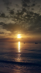 Obraz premium Sunset over the beach in Caribbean