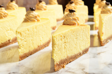Slice of NY style Cheese cake on buffet table 