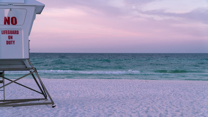Empty Lifeguard Station on a beautiful tranquil white sand beach in Florida.