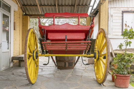 A wooden ox cart storage at Cobquecura rural town in South Chile, Old transportation for taking seafood from the sea to the village inside the wooden barrels. Remembering the traditional works, Chile