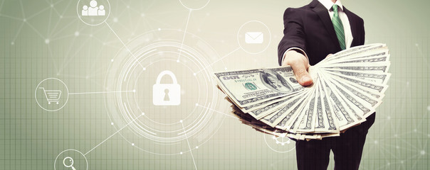 Cyber security with business man displaying a spread of cash