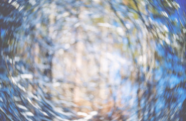 Blurred defocused snowy abstract winter forest background