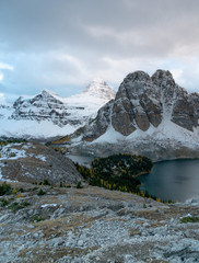 Mount Assiniboine is peaking out of the clouds just before sunset