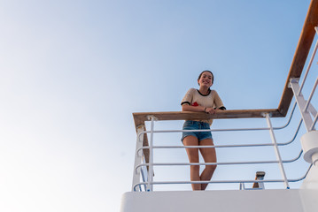 Teen on deck of ferry boat