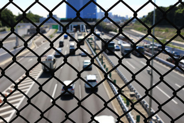 Wire mesh surrounding highway