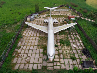 The old plane in green field by drone