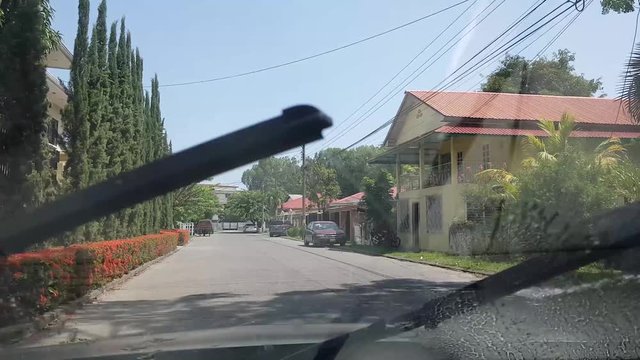 Driving green car in the city of La Ceiba in the contry of Honduras