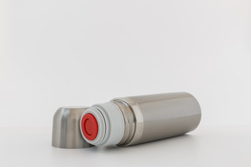 Stainless steel vacuum flask , Keep hot water on white background