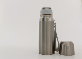 Stainless steel vacuum flask , Keep hot water on white background