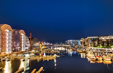 Colorful buildings and hotels and  the Nidelva River at 2 am, Trondheim, Norway.