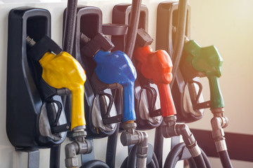 Colorful Petrol pump filling nozzles, Gas station in a service