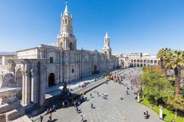 Fototapeta na wymiar Peru Arequipa basilica cathedral and Arms square gardens in a sunny day with blue sky