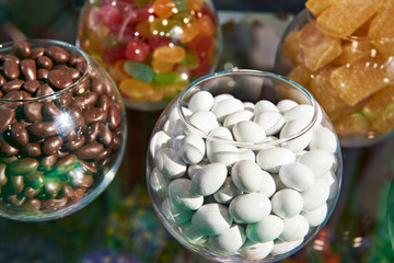 White dragee candy on store