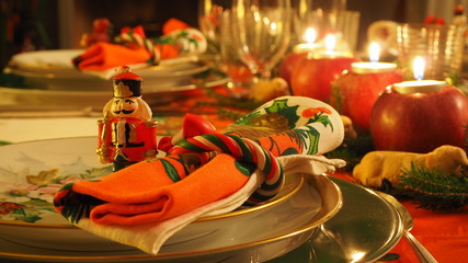 Christmas table set with decorated napkin and toy soldier