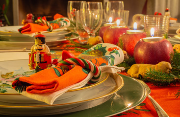 Christmas table set with decorated napkin and toy soldier