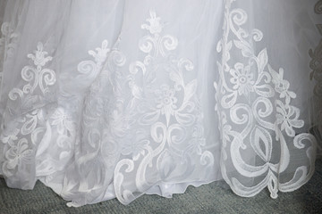 Texture of white lace fabric. The element of the wedding dress.