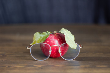 red apple with glasses