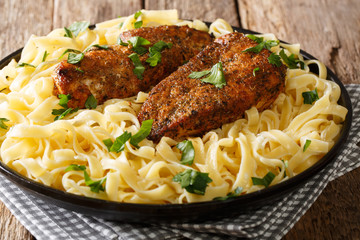 delicious recipe for rich and creamy Chicken Lazone Pasta from New Orleans close-up on a plate. horizontal