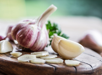 Garlic bulb and garlic cloves  on the wooden table.