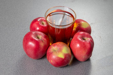 red apples and glass of juice