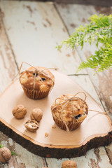 Dellicious homemade nut muffins on table. Sweet pastries