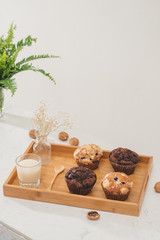 Breakfast with fresh homemade delicious muffins and milk.