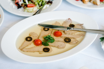Cold meat dish. Jelly with boiled tongue, pouring. Boiled beef tongue.