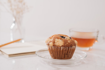 Breakfast with fresh homemade delicious muffins and tea.