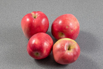 red apples on a grey background