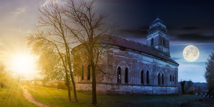 time change concept with sun and moon. panorama of abandoned catholic church on hill