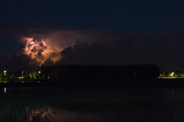 Thunderstorm cloud early in the morning, in summer before sunrise