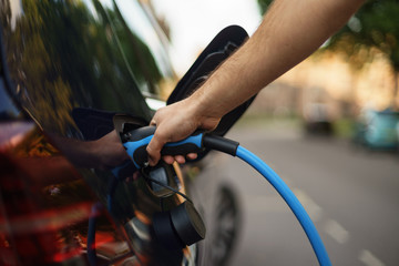 Charging electric car on street