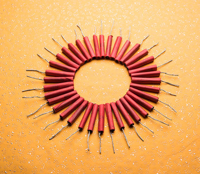Diwali Firecrackers along with Clay oil lamp or Diya arranged over white background to create a beautiful rangoli or design