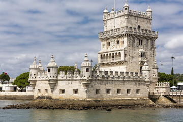 Fototapeta na wymiar Torre de Belem (Belem Tower) sits on the river Tagus in Lisbon and is a fortified tower