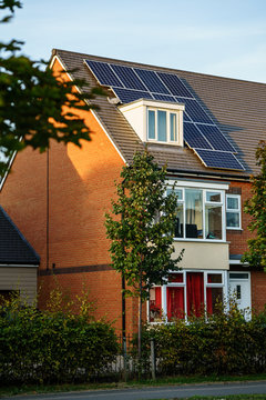 English House with Solar Panels on roof for electisity
