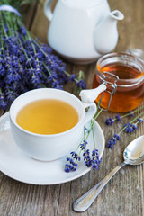 Cup of tea and honey with lavender flowers