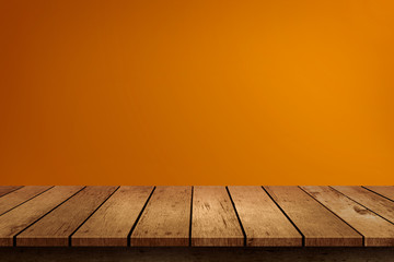 Halloween empty wooden tabletop on orange background. Use for product display montage.
