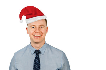 Portrait of young business man in a Santa's cap isolated on a white background.